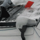 Snow pushes man off roof