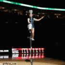 Unicycle acrobat flips 5 bowls on to head