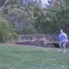 Cyclist owned by frisbee players