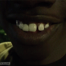 Kid does trick with his tooth