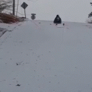 Girl sleds into water