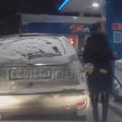 Woman checks gas with a lighter