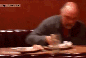 Man at restaurant eats napkin