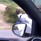Kid hanging behind truck for ride to school