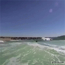 Wave throws boadyboarder in the air