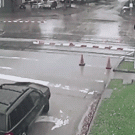 Minivan crossing tram tracks