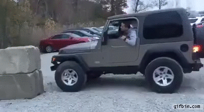 jeep-tries-to-climb-rock.gif