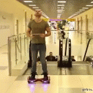 Guy does balancing act at shopping mall