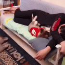 Dog removes sleeping puppy from couch