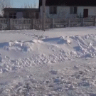 Kid rides leaf blower-powered sled