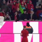 People stop fan from taking shirt from kid