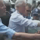 Bush wipes hand on Clinton's shirt