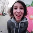 Laughing girl headbutts camera