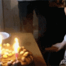 Kid spits on cake while blowing candles