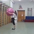 Girl does backflips with exercise ball