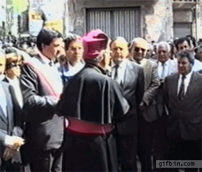 1366132965_priest_confuses_mic_for_aspergillum.gif
