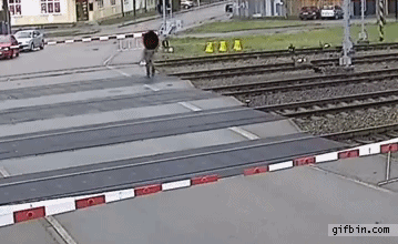 1398361230_man_nearly_hit_by_train.gif