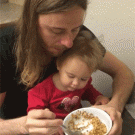 Baby wants to eat daddy's cereal
