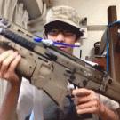 Kid uses airsoft gun to brush teeth