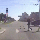 Tractor picks up matress fallen off truck