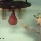 Kid owns himself with punching bag