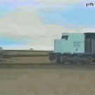 Train hits logging truck