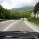 Truck tips and hits car