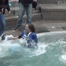 High schoolers push photographer into fountain