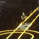 U2's The Edge falls off the stage