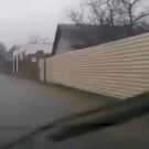 Guy dus a split in the middle of wet road