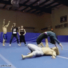 Man lifts and hurls woman with one arm