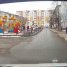 Little girl plays traffic controller for kids crossing street