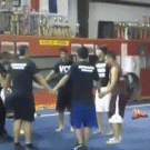 7 people holding hands backflip attempt