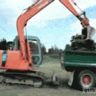 Excavator gets on/off truck