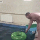 Fat guy jumps through swim ring