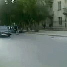 Car almost hits man during handbrake turn