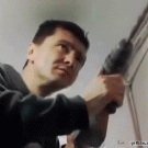 Guy slaps self with power drill