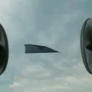 Paper airplane between two fans