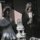 Bride gets a champagne cork to the face