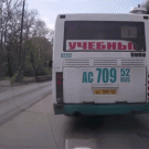 Almost hit by truck while crossing street behind bus