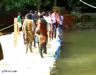 1418018539_man_jumps_in_water_to_save_ki