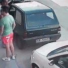 Man pushes car out of parking lot