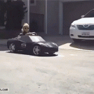 Kid drifts in toy car like a boss