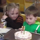 Girl blows kid's candels