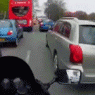 Biker fixes car mirror