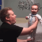 Balancing laughing baby