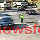 Traffic cop gets hit by bull in intersection