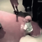 Baby drinks while dancing