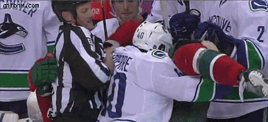 1323717963_hockey_referee_gets_punched.g