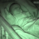 Playing with sleeping baby's arms